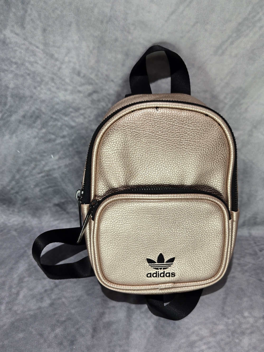 Adidas Originals mini PU leather backpack in a striking rose gold finish